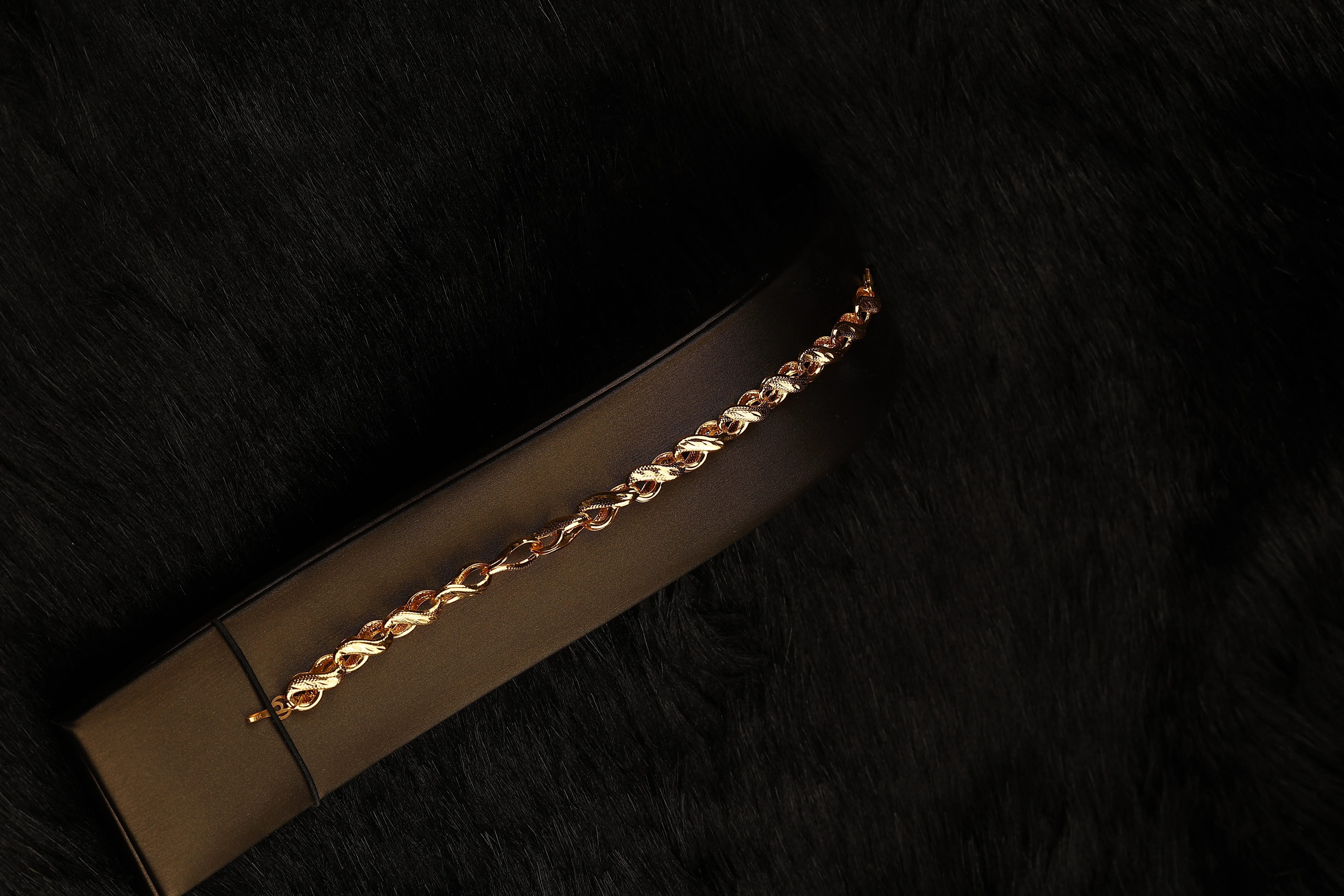 “Braid of Light” 21K Gold Bracelet – Twisted Link Design